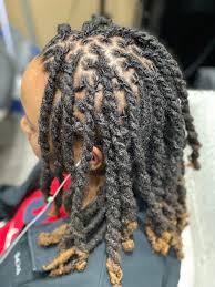 Whether you wear your hair in locs or not, this braided bun by chescalocs will save your everyday bun from getting boring. Essence Naturals Salon