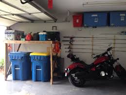 Garage Organization We Built A Platform Shelf To Go Over The Garbage Cans And Hung Up Fishing Poles Using Garage Organization Garage Organisation Garbage Can