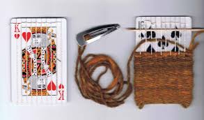 This is a playing card holder made from cardstock. New Tricks Up Your Sleeve Old Playing Card Crafts To Fall In Love With