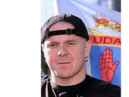 Adair freed from prison and flown to England