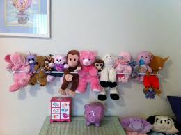 Is Your Kid S Room Overflowing With Toys Corral Them With These Genius Stuffed Animal Storage Ideas Soft Toy Storage Stuffed Animal Storage Baby Toy Storage