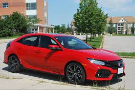 Civic sedan features a sleek profile and a long wheelbase, making it sporty even when standing still. Civic Touring Hatchback Is A Winning Recipe Wheels Ca