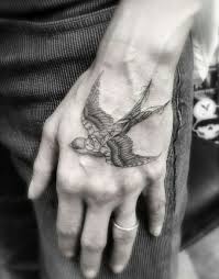 Swallow Bird Tattoo On Hand Meaning Geometric Swallow By Dr Woo Bird Tattoo Men Bird Hand Tattoo Tattoos For Guys