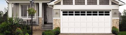 These matching garage doors mimic the traditional doors seen on most houses but with wooden shutters and window boxes match the doors and add to the home's farmhouse design. Wood Garage Doors Hand Built Beautiful Wood Doors
