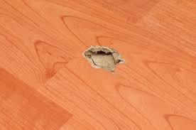 When sanding minor scratches, restrict your sanding to the scratched area, feathering only slightly into the surrounding surface. How To Fix Dents In Hardwood Floors For Beginners Rhythm Of The Home