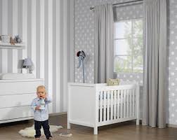 Modern boy's nursery features a horse mobile over a black nursery crib against a wall clad in fornasetti nuvole framed. Dot Wall Decoration Ideas Super Fun Ideas For Nursery Rooms
