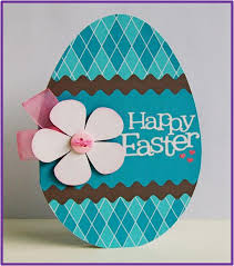 Layer patterned paper, playful ribbon, and a glittery flower to make this delightful easter card. How To Make Easter Egg Cards