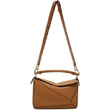This stunning shoulder bag is crafted of smooth calfskin leather in brown. Loewe Tan Small Puzzle Bag In 3649 Light Modesens