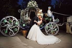 A Fairy Tale Wedding Inspired Kiss Full Of Romance In Front Of Cinderella S Coach At Disneyland Disneyland Wedding Disney Wedding Disney World Wedding
