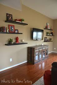 How To Decorate Around A Tv With Floating Shelves Whats Ur Home Story Living Room Shelves Floating Shelves Living Room Shelves Around Tv Choose from simple metal stands to traditional cabinets with storage space.