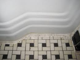 Their small 1″ size allowed for some very creative mosaic patterns to be incorporated by a skilled tile setter. Clean Vintage Bathroom Tiles Caulk More Cleanly With Painter S Tape