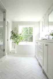 Welcoming White Bathroom Is Fitted With Honed White Marble Herringbone Floor Til Bathroom White Marble Bathrooms Herringbone Tile Bathroom White Bathroom