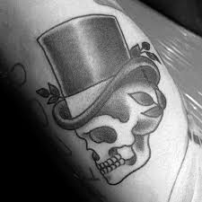 Nba player, has got a skull with military helmet and the word soldier underneath. 30 Skull With Top Hat Tattoo Designs For Men Manly Ink Ideas