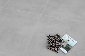 Choose a more neutral shade of grout that is close to your tile color, for example, yellow tiles with a beige grout, blue tiles with grey grout, or white tiles with grey grout. Creative Concrete Light Grey Matt 1000x1000 Code 01756 Cheapestiles