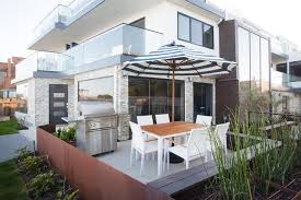 Resistant to suntan oils, chlorine and saltwater. California Beach Style Patio With Black And White Striped Umbrella Cottage Deck Patio