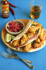 One at a time, shake off the excess flour, dip the strips into the batter, and then drop them into the fryer. Beer Battered Fish Tacos With Spicy Slaw Drizzle And Dip