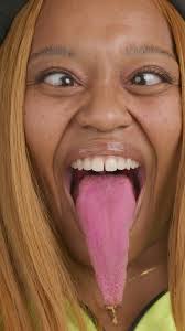 Longest tongue (female) 😝 9.75 cm (3.8 in) measured from the tip to the  middle of lip