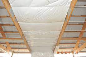 After taping all of the joints i applied osb to all of the walls to give a durable surface that i could hang tools on, add shelves etc. Pole Building Insulation Installed At The Bottom Of The Rafters Insulation Following The Roof Pitch Pole Barn House Plans Pole Barn Insulation Pole Barn Homes