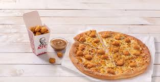 Tomato sauce, mushrooms, peppers, olives, sweetcorn, red onion, rucola. Kfc In Gravy We Crust Pizza Hut Delivery And Kfc Launch The Popcorn Chicken Pizza