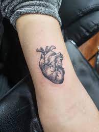 This tattoo includes an abstract tribal design from the polynesian tribe and includes some different and complex shapes that make up the whole tattoo. Anatomical Heart Tattoo