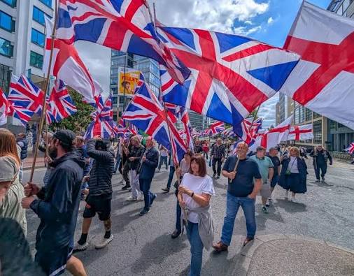 England's anti-migrant 'patriots' resort to foreign habit of putting up flags