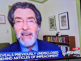 Looks like horns above his head!!!????