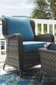 Abbots Court 4 Piece Patio Set By Ashley Furniture Soft Driftwood Hued Resin Wicker Adds Romance Without The Worry Of Patio Set Backyard Living Outdoor Chairs