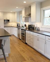 The material will be smooth to the touch. Geneseo Il White Painted Kitchen With Matte Black Granite And Subway Tile Transitional Kitchen Chicago By Village Home Stores Houzz
