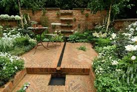 Black says that using the same plant along both sides of a long path is a technique to create structure that, in a traditional english garden, might be achieved with boxwood (buxus sempervirens). Brownstone Garden Design Todd Haiman Landscape Design