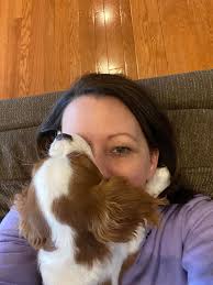 Do Cavalier King Charles Spaniels typically give hugs and whine when giving  kisses?