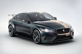 Jaguar Xe Sv Project 8 In Black With A Gold Strip Running From The Front To The Back Of The Car Jaguar Xe Jaguar Car Jaguar