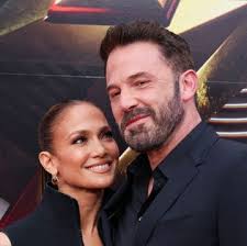 Jennifer Lawrence Takes the Big Red Coat Trend to the Red Carpet