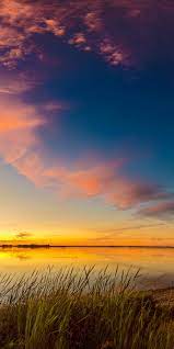 This earth day, take a look at some of the most captivating pictures of nature. Sunrises And Sunsets Scenery Lake Sky Nature 1440x2880