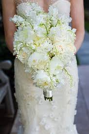 Exquisitely Arranged Bridal Bouquet Which Showcases White Peonies White Sweet Pea Cream Roses Lily Of The Valley Bridal Bouquet Wedding Bouquets Wedding