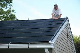 Steve Mellinger Tying Down A Panel Lancaster Pa Solar Lancaster County Green Building Solar Pool Solar Pool Heating Solar Pool Heater Diy Solar Pool Heater