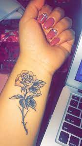 A lily flower tattoo usually looks good in small size but you can try it in large sizes too. Rose Wrist Tattoo Rose Tattoos On Wrist Flower Wrist Tattoos Wrist Tattoos For Women