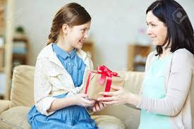 African american mother daughter giving gift box each other happy new year merry christmas concept fir tree decoration. Mother Giving Package With Gift To Her Daughter Stock Photo Picture And Royalty Free Image Image 54474215