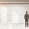 An interior wall with door creates 2 separate office spaces. 1