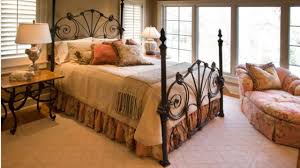 Absolutey gorgeous french country style outdoor terraced space with shabby white painted chipped decorative metal daybed piled with big slouchy faded floral linen cushion's & mattress in soft pastel's, decorative. Wrought Iron Bed As A Stylish And Functional Interior Element Small Design Ideas