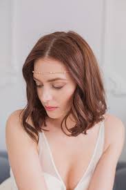 A simple gold wedding hair vine