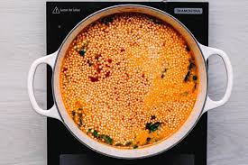 Add garlic, chili flakes, thyme, and a sprinkling of salt, and pepper; Couscous Soup Flavorful Tomato Broth Posh Journal