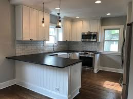 Renovated Vintage Farmhouse Style Kitchen Black And White Gray Owl Paint Ha White Shaker Kitchen White Shaker Kitchen Cabinets Kitchen Remodel Countertops