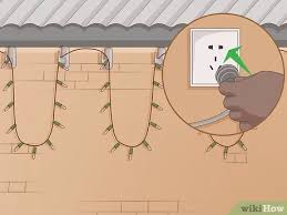How to hang up lights outside. 3 Ways To Hang Christmas Lights Outside Without Nails Wikihow