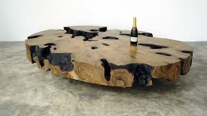Low tables made of a wooden top with an important thickness mounted on metal feet with h. Contemporary Coffee Table Ovale Jerome Abel Seguin Petrified Wood