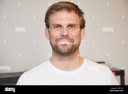 Hamburg, Germany. 25th Mar, 2021. Andre Nagel (l), Managing Director of  Meridian Spa & Fitness, and Niclas Müller, Project Manager at Upsolut  Sports, stand next to a sign reading "Schnelltest Service Hamburg