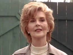 Bridget Regan in a marketing photograph for her role as Dottie Underwood in  the "Agent Carter" TV series. She looks ready to appear