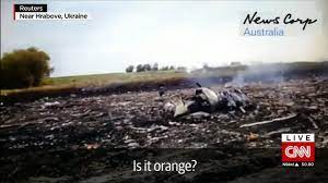 A local resident stands among the wreckage at the site. Mh17 Australia Slams Video Of Apparent Crash Aftermath Cnn
