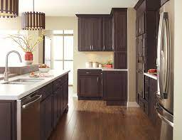To ensure highest satisfaction, we suggest you view an actual sample from your dealer for best color, material grain and finish representation. Dark Finish Modern Kitchen Cabinets Kemper Cabinets