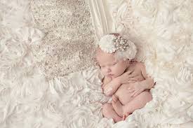 A tennessee woman has come under fire for her decision to attach her newborn daughter to the train of her wedding dress and drag her as she walked down the aisle. Newborn Girl Picture With Mothers Wedding Dress Baby Girl Newborn Pictures Newborn Pictures Girl Newborn Baby Photography