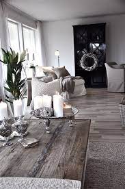 The couch closely resembles a daybed, covered in plus white and gray blankets and pillows. Interior Blogg Villa Paprika Rustic Living Room Home Decor Chic Living Room